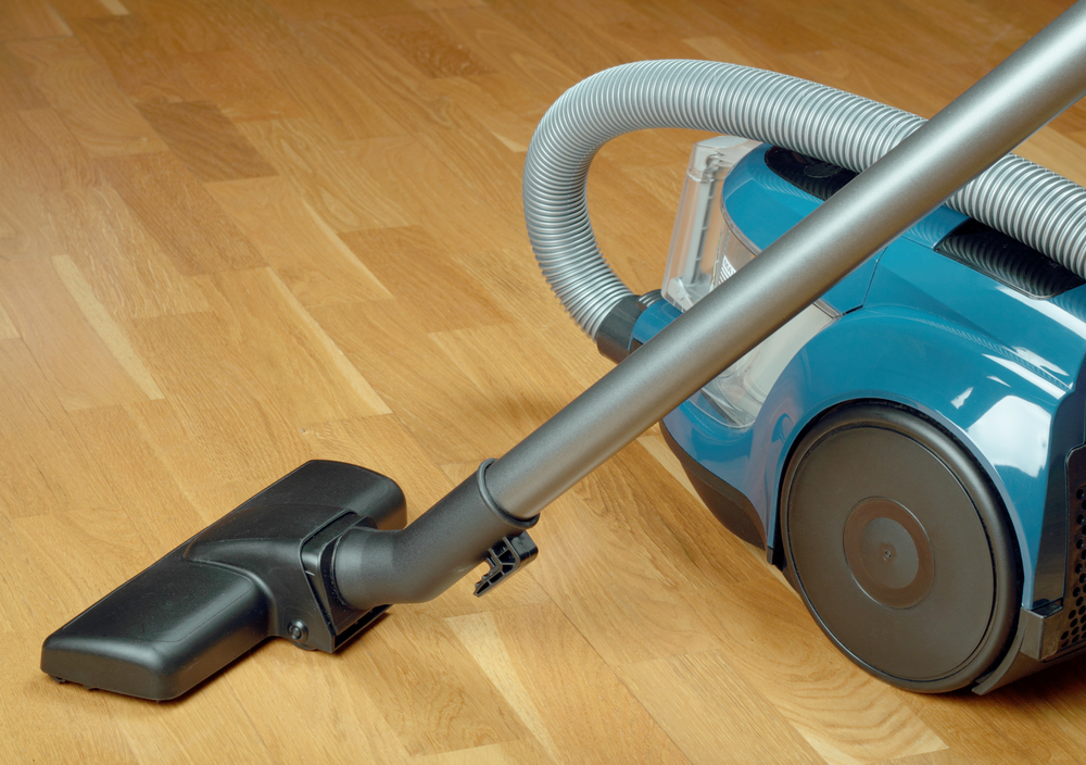 Can I use a vacuum cleaner to clean my hardwood floor?